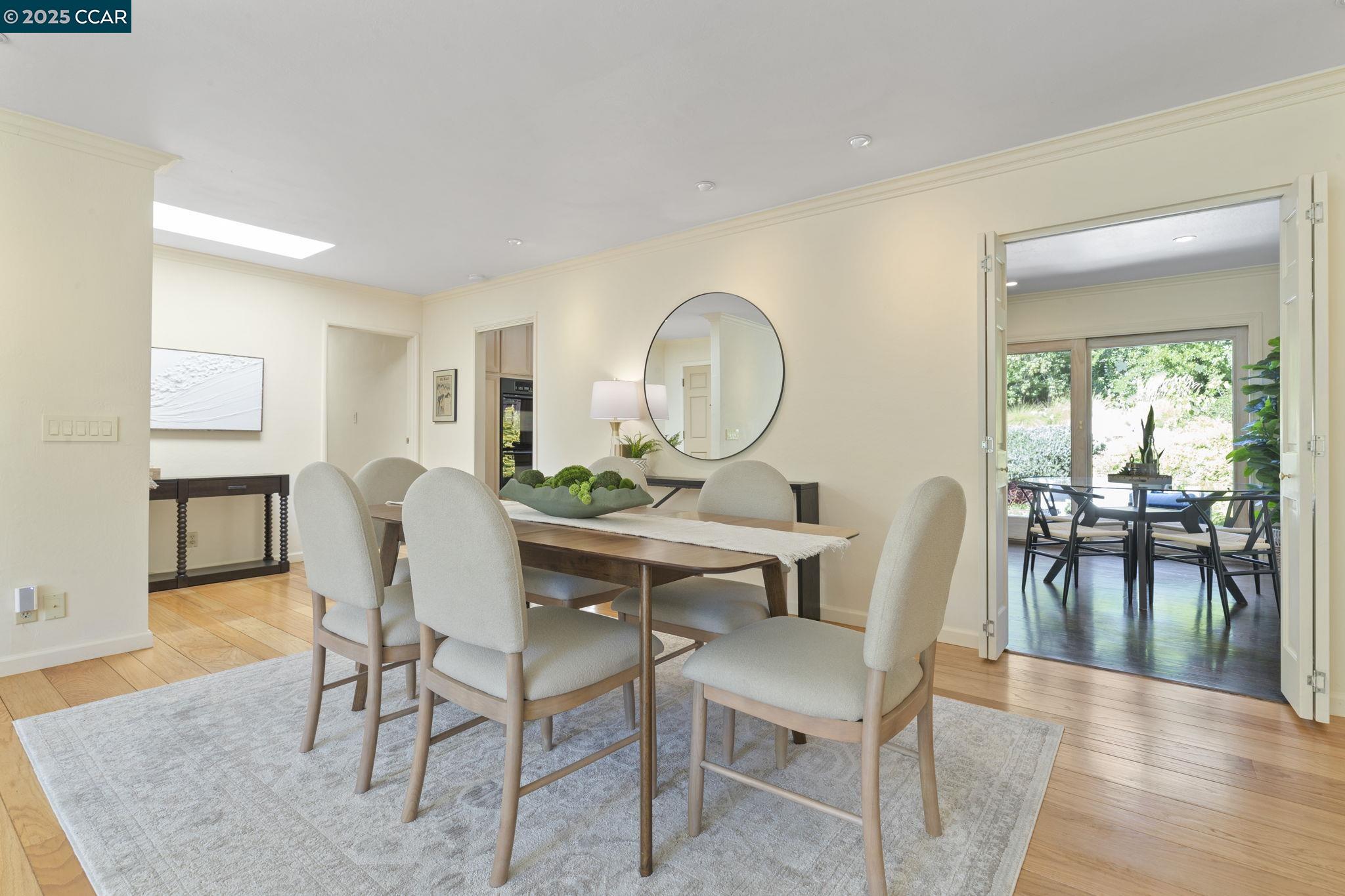 275 Gil Blas Road Danville, CA 94526 - Photo 13 of 39 a view of a dining room with furniture and wooden floor