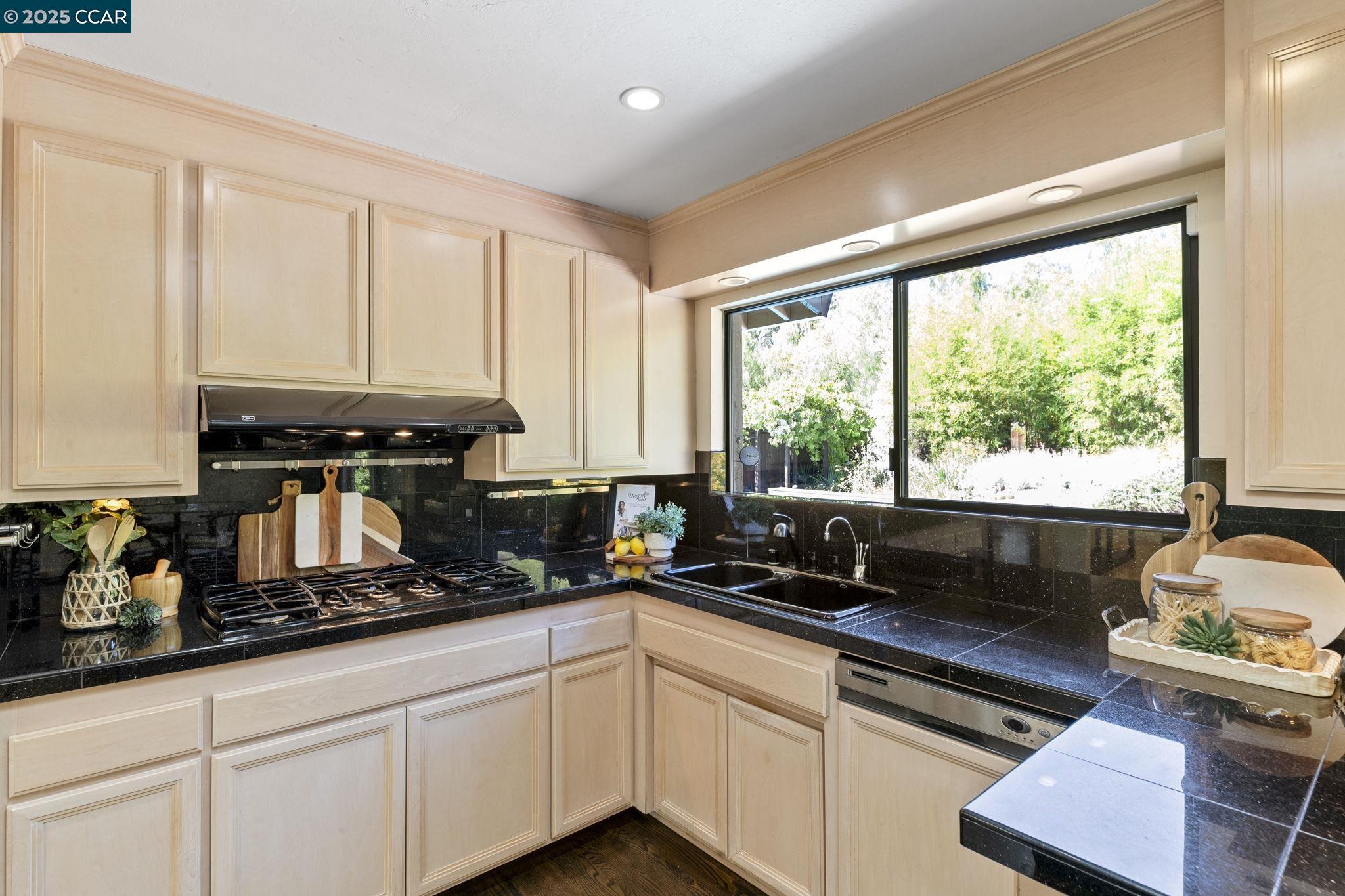 275 Gil Blas Road Danville, CA 94526 - Photo 17 of 39 a kitchen with sink a window and cabinets