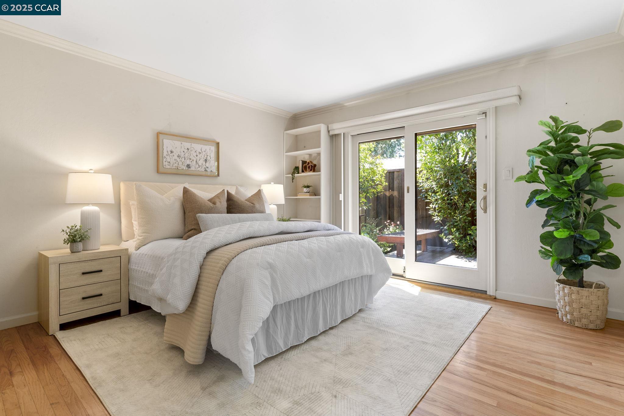 275 Gil Blas Road Danville, CA 94526 - Photo 24 of 39 a spacious bedroom with a large bed and a potted plant