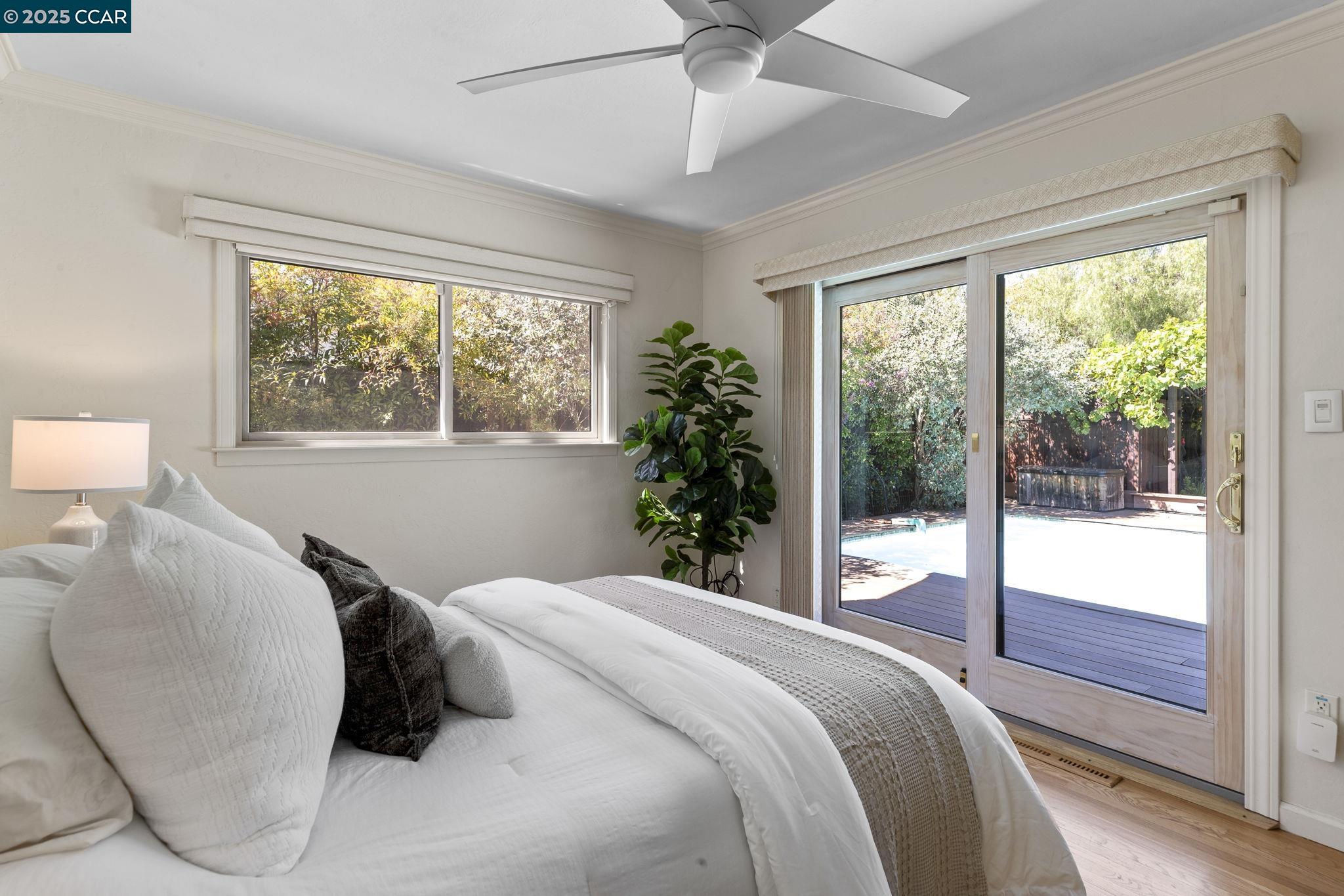 275 Gil Blas Road Danville, CA 94526 - Photo 26 of 39 a bedroom with a large bed and a large window