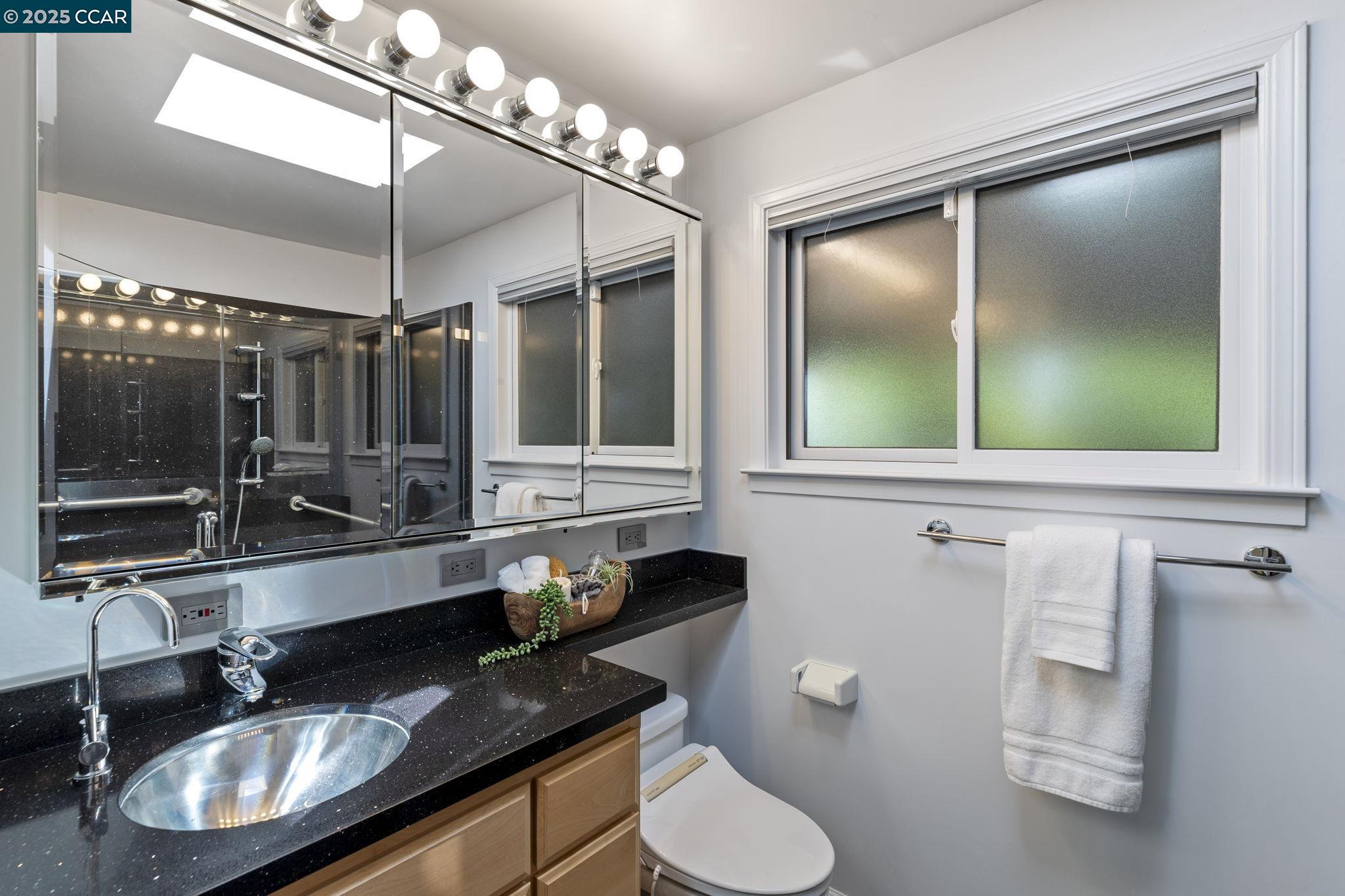275 Gil Blas Road Danville, CA 94526 - Photo 28 of 39 a bathroom with a toilet a sink and mirror