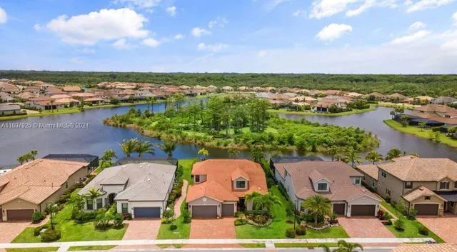 an aerial view of a house with a lake view