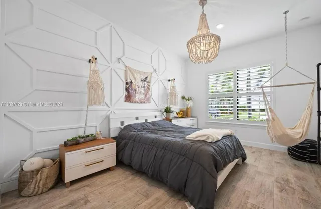 a spacious bedroom with a bed and a window