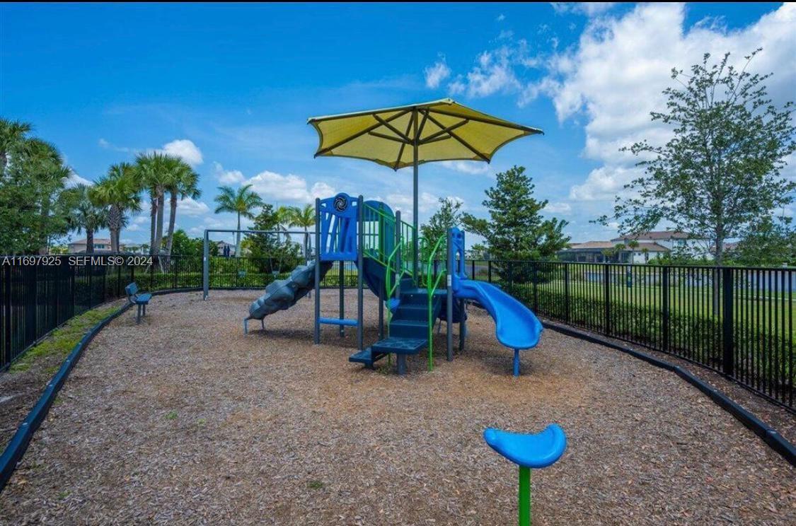 141 Cinder Dunes Point Jupiter, FL 33478 - Photo 31 of 35 a view of a park with slide