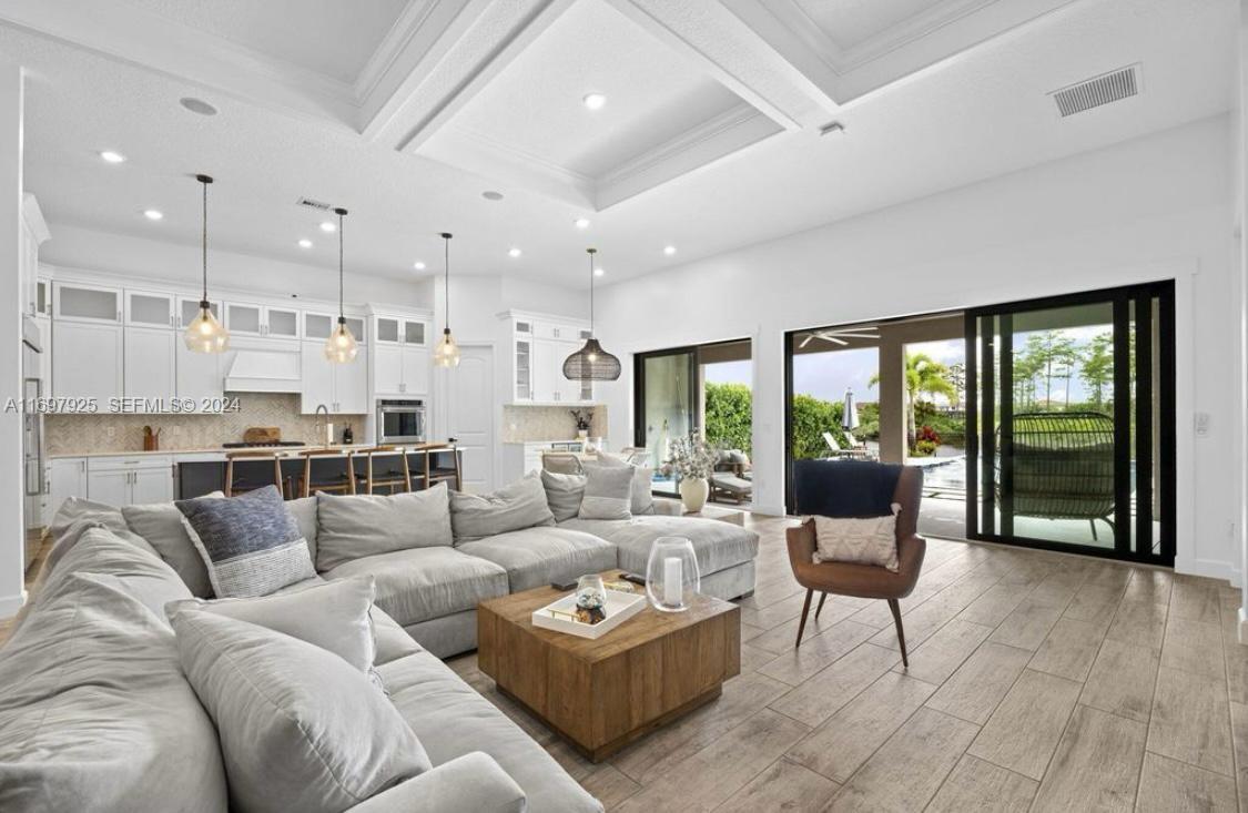 141 Cinder Dunes Point Jupiter, FL 33478 - Photo 7 of 35 a living room with furniture and a large window