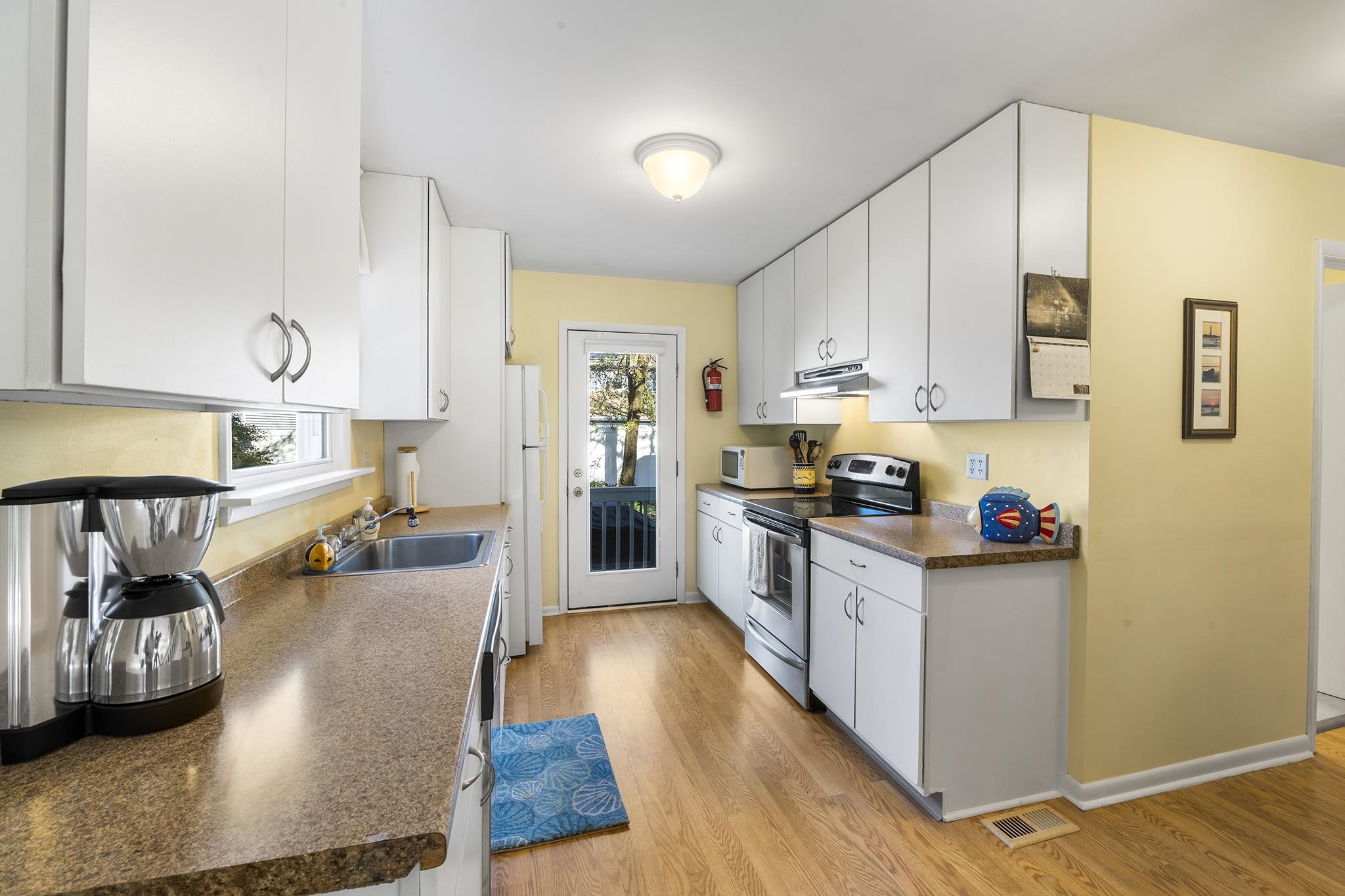 513 Robin Road Villas, NJ 08251 - Photo 14 of 34 a kitchen with stainless steel appliances granite countertop a refrigerator sink and cabinets