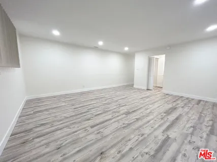a view of room and wooden floor