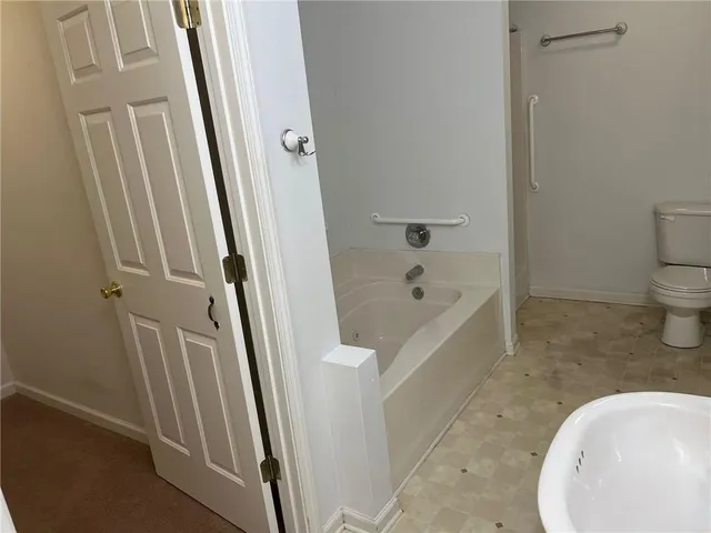 a bathroom with shower and bathtub
