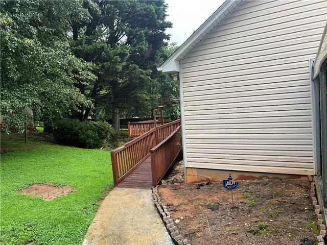 a backyard of a house with lots of green space
