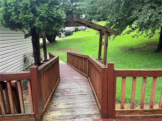 a view of a deck with a backyard