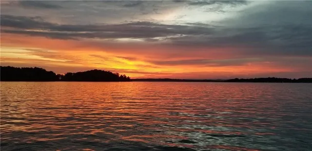 a view of ocean with sunset