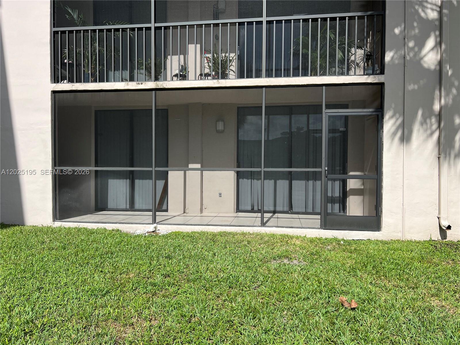 8400 Southwest 133rd Avenue Road, Unit 121 Miami, FL 33183 - Photo 3 of 43 a backyard of a house with lots of green space and plants