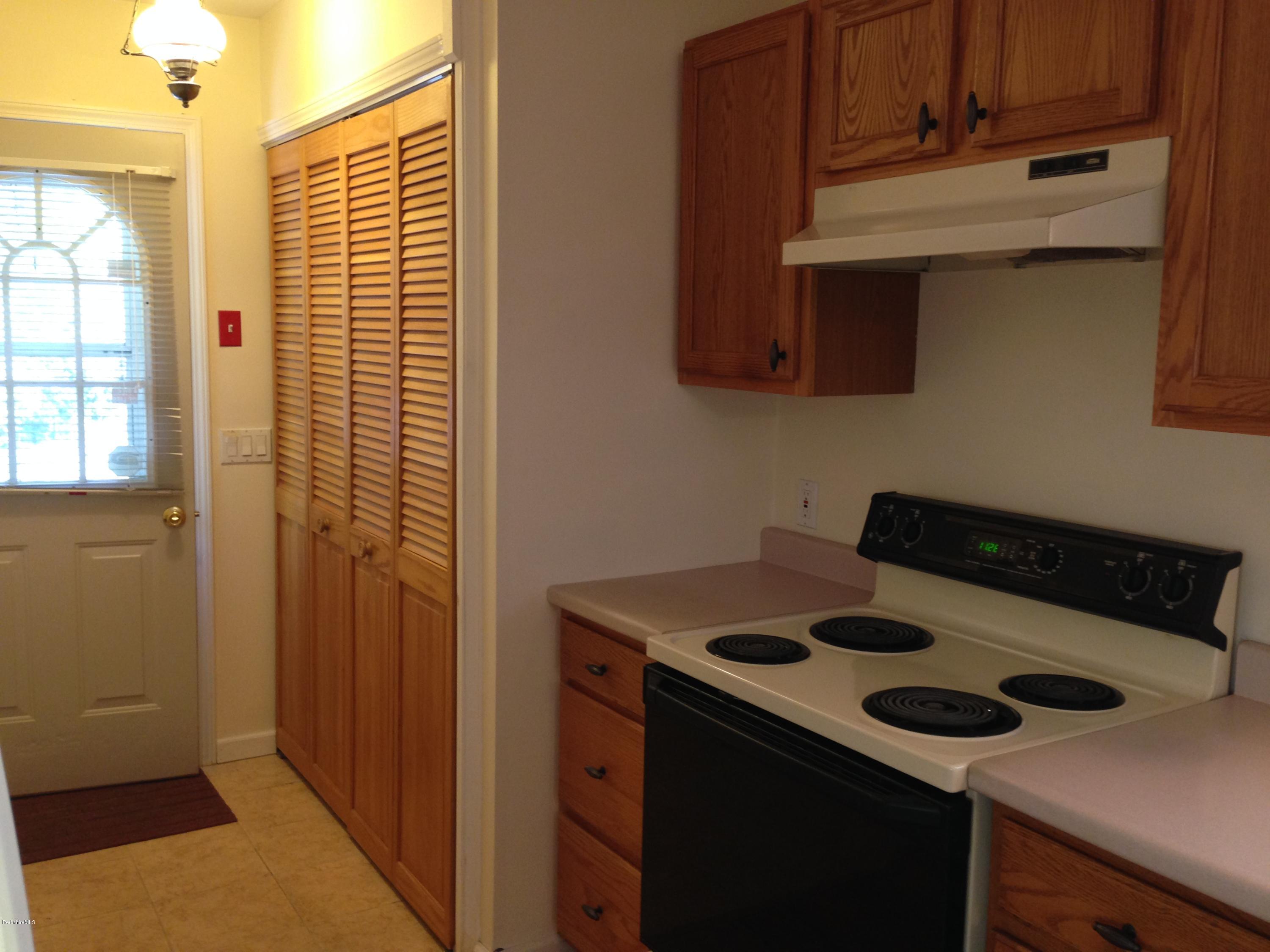 999 Holmes Road Pittsfield, MA 01201 - Photo 9 of 33 laundry behind louvred doors