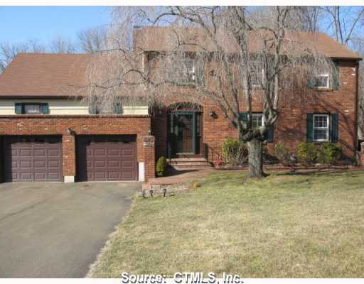 20 Westview Road North Haven, CT 06473 - Photo 1 of 1 a view of a house with a small yard and large tree