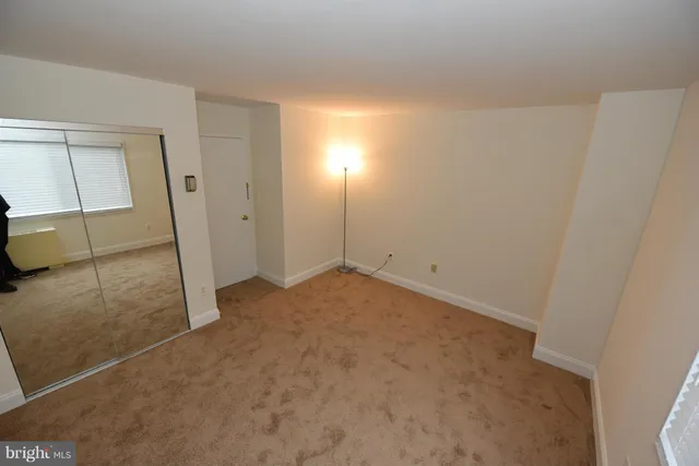 a view of a room that has a window in it