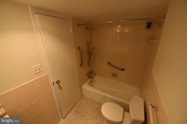 a view of gallery with wooden floor