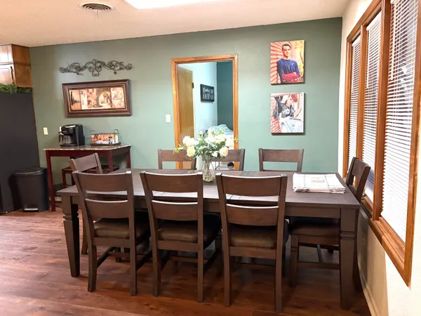 a dining room with furniture and window