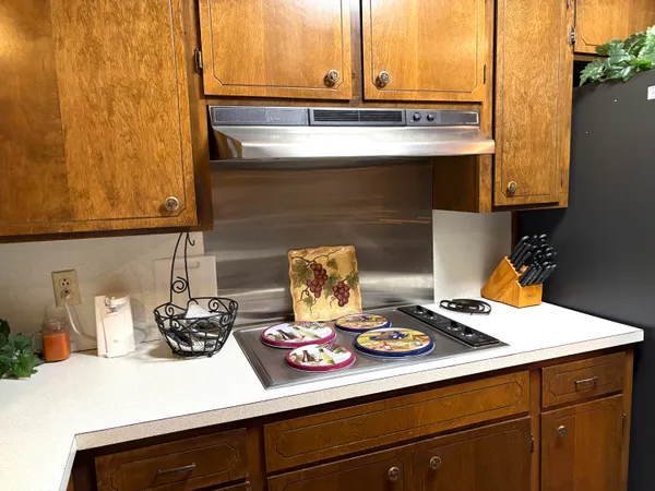 a kitchen with a stove and a microwave