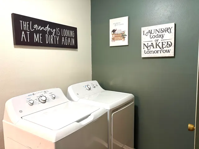 a utility room with dryer and washer