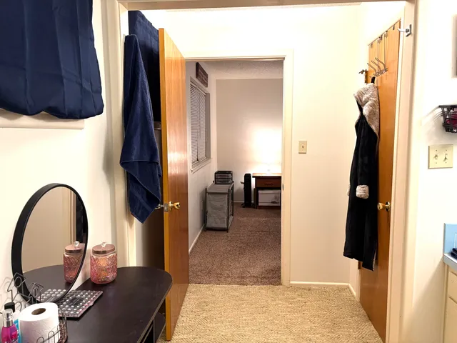 a view of living room with furniture and a window