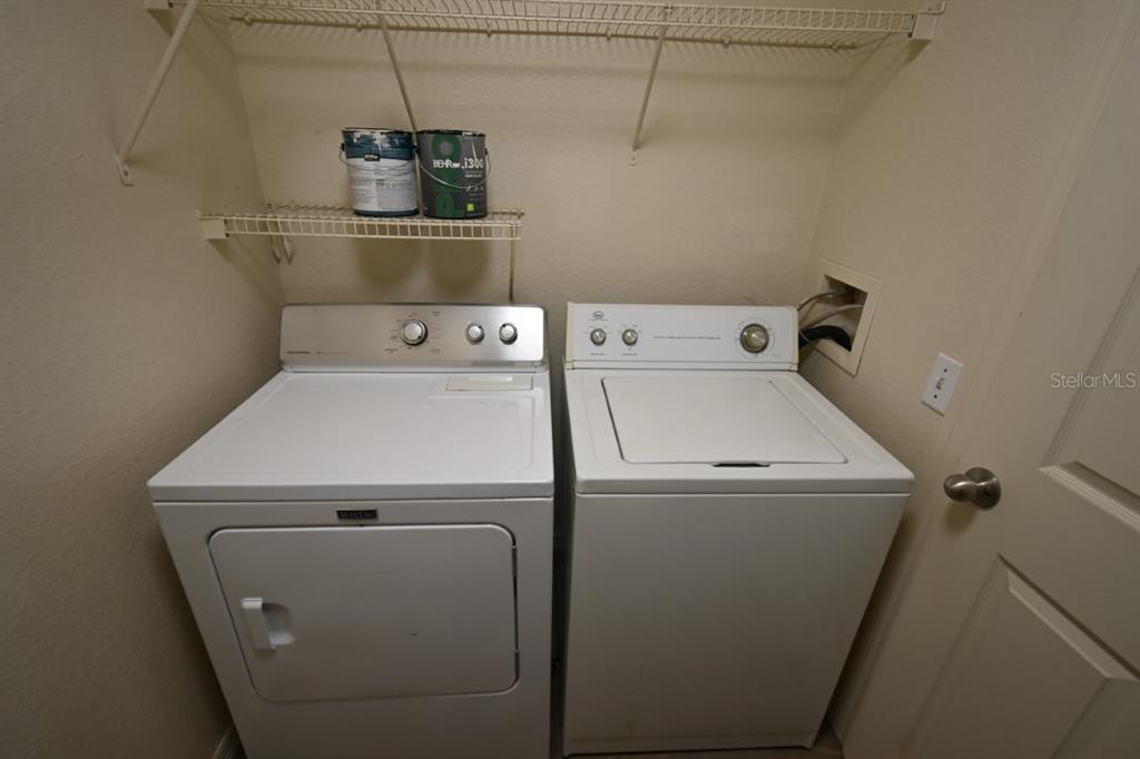 36047 Deer Creek Drive, Unit 102 Zephyrhills, FL 33541 - Photo 11 of 37 a utility room with dryer and washer