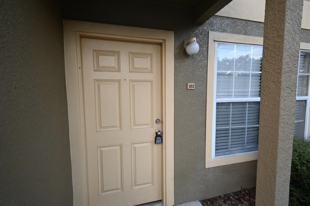 36047 Deer Creek Drive, Unit 102 Zephyrhills, FL 33541 - Photo 4 of 37 a view of front door of a house