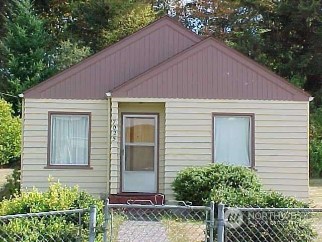 a aerial view of a house with a yard and plants