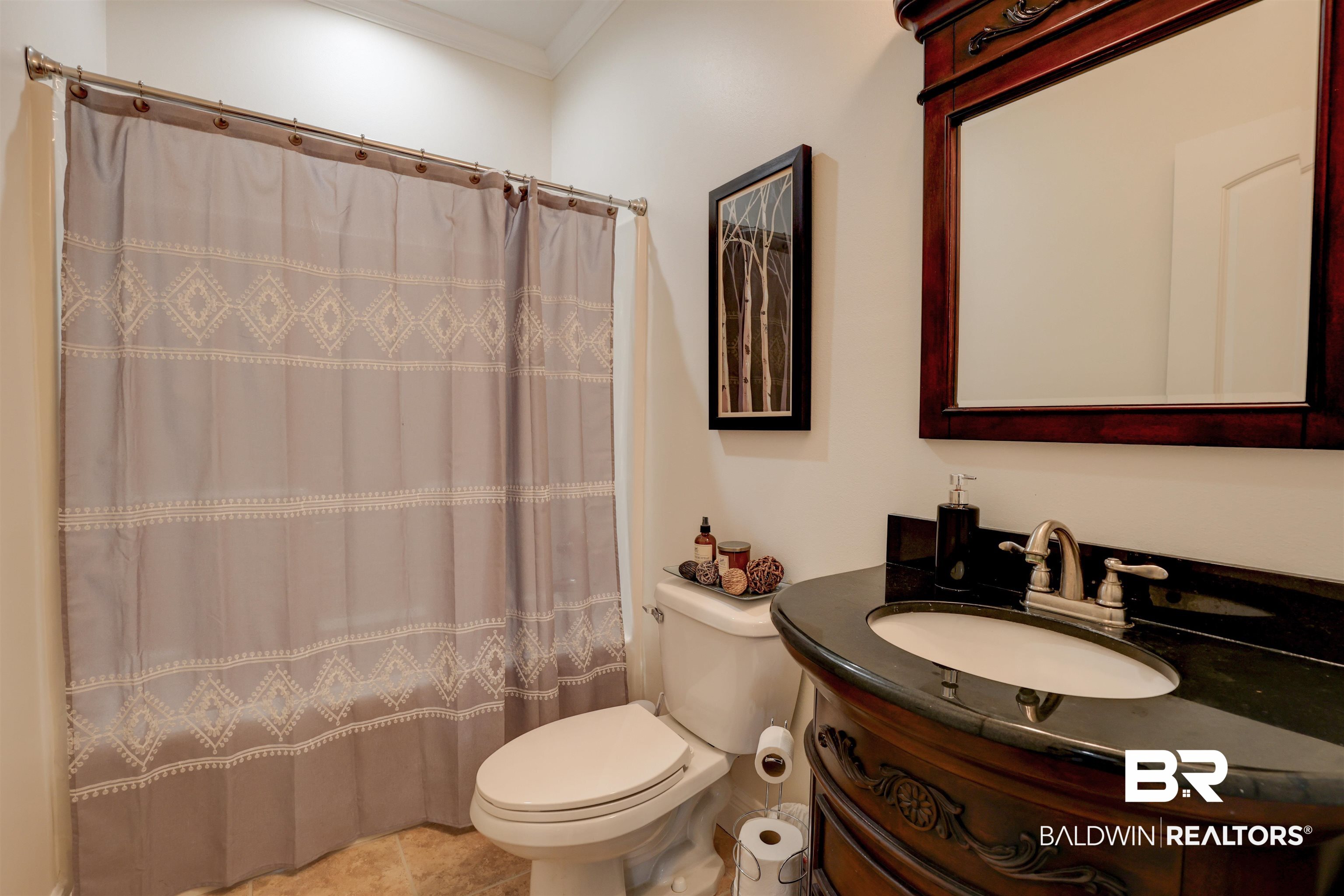 5565 Dawes Lane Theodore, AL 36582 - Photo 15 of 38 Bathroom with toilet, tile patterned floors, crown molding, vanity, and curtained shower