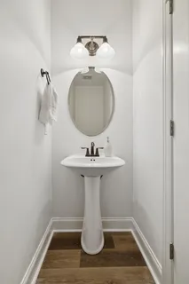 a bathroom with a sink a mirror and window