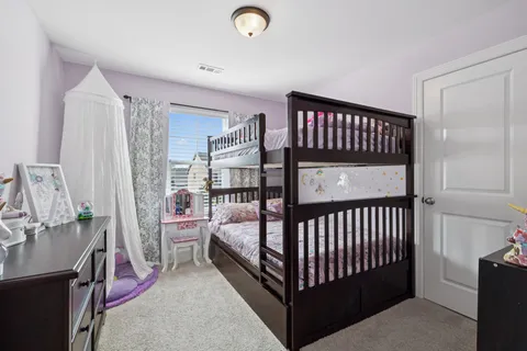 a bathroom with a sink vanity mirror and toilet