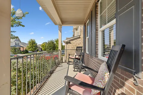 a view of balcony with furniture