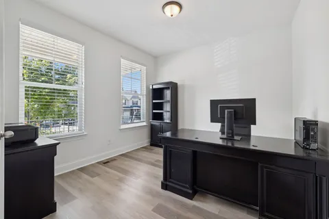 a kitchen with a sink cabinets and window