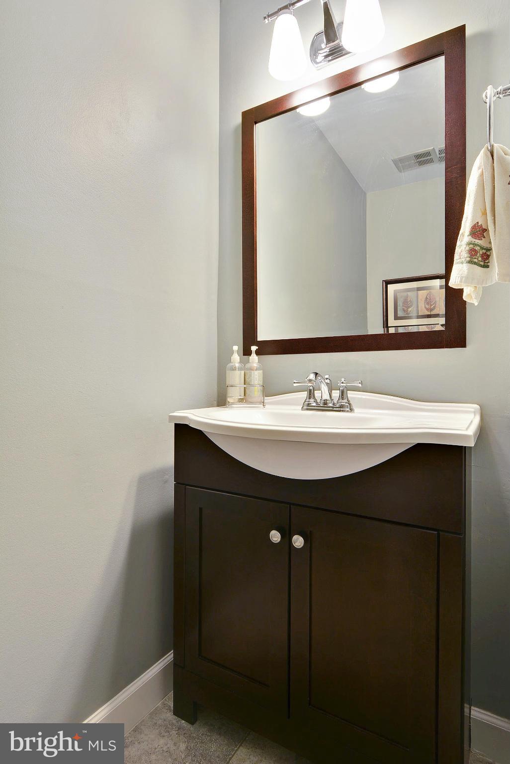 2024 Golf Course Drive Reston, VA 20191 - Photo 18 of 30 a bathroom with a sink and a mirror