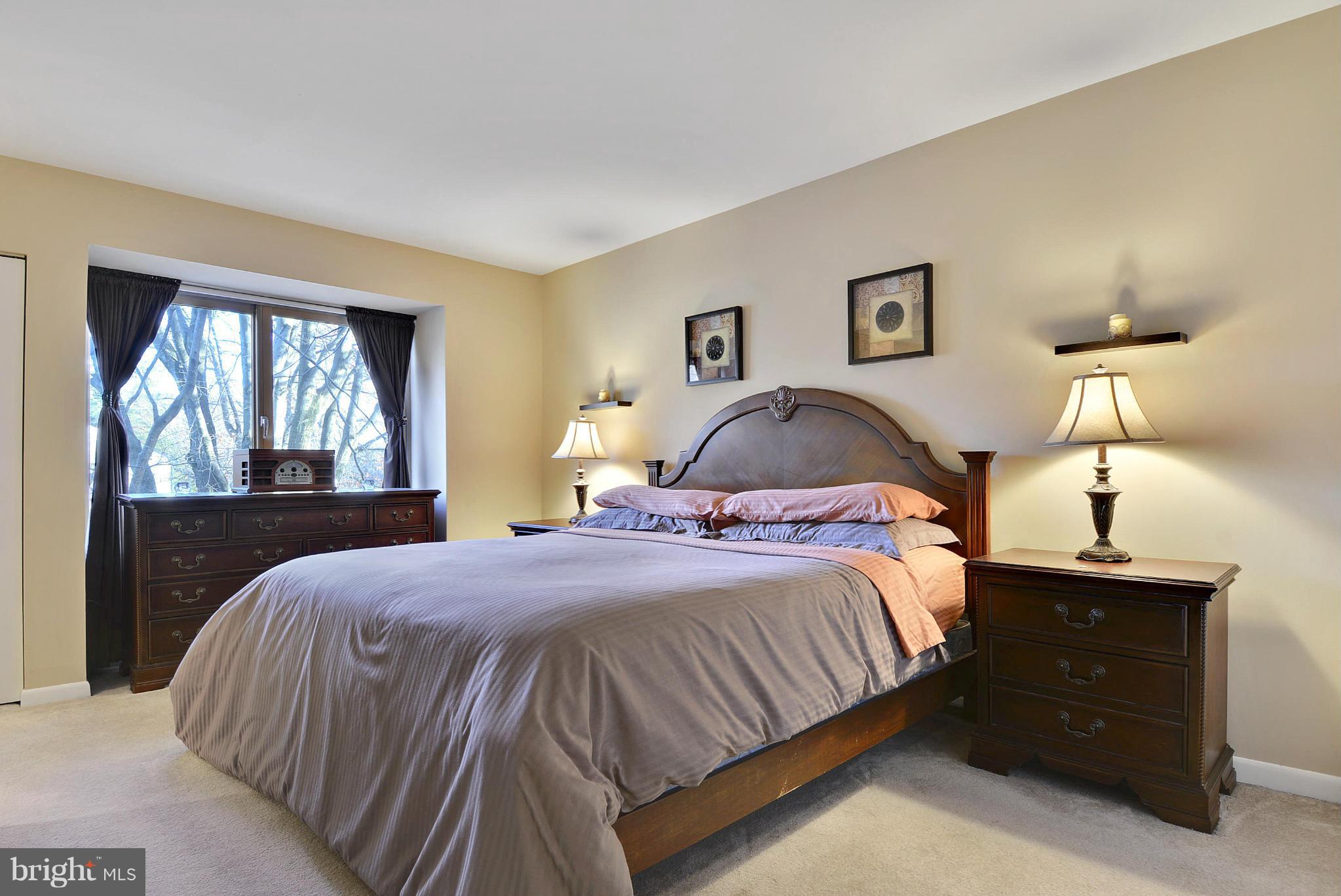 2024 Golf Course Drive Reston, VA 20191 - Photo 20 of 30 a bedroom with a bed and a painting on the wall
