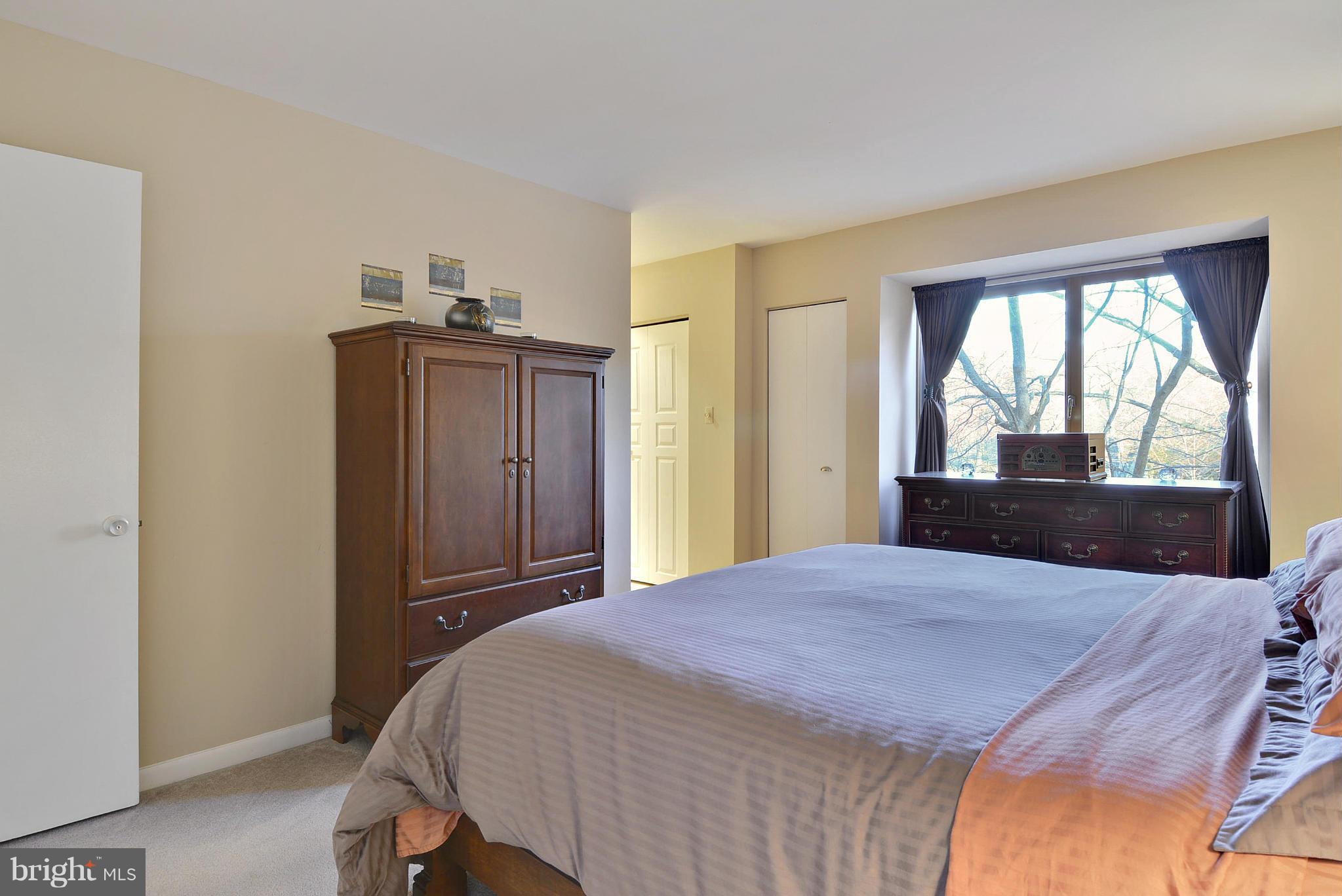2024 Golf Course Drive Reston, VA 20191 - Photo 21 of 30 a bed sitting in a bedroom next to a window