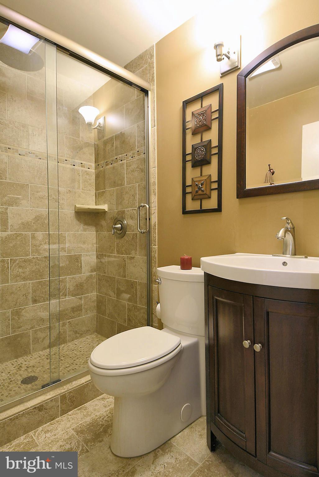 2024 Golf Course Drive Reston, VA 20191 - Photo 27 of 30 a bathroom with a sink a toilet and shower