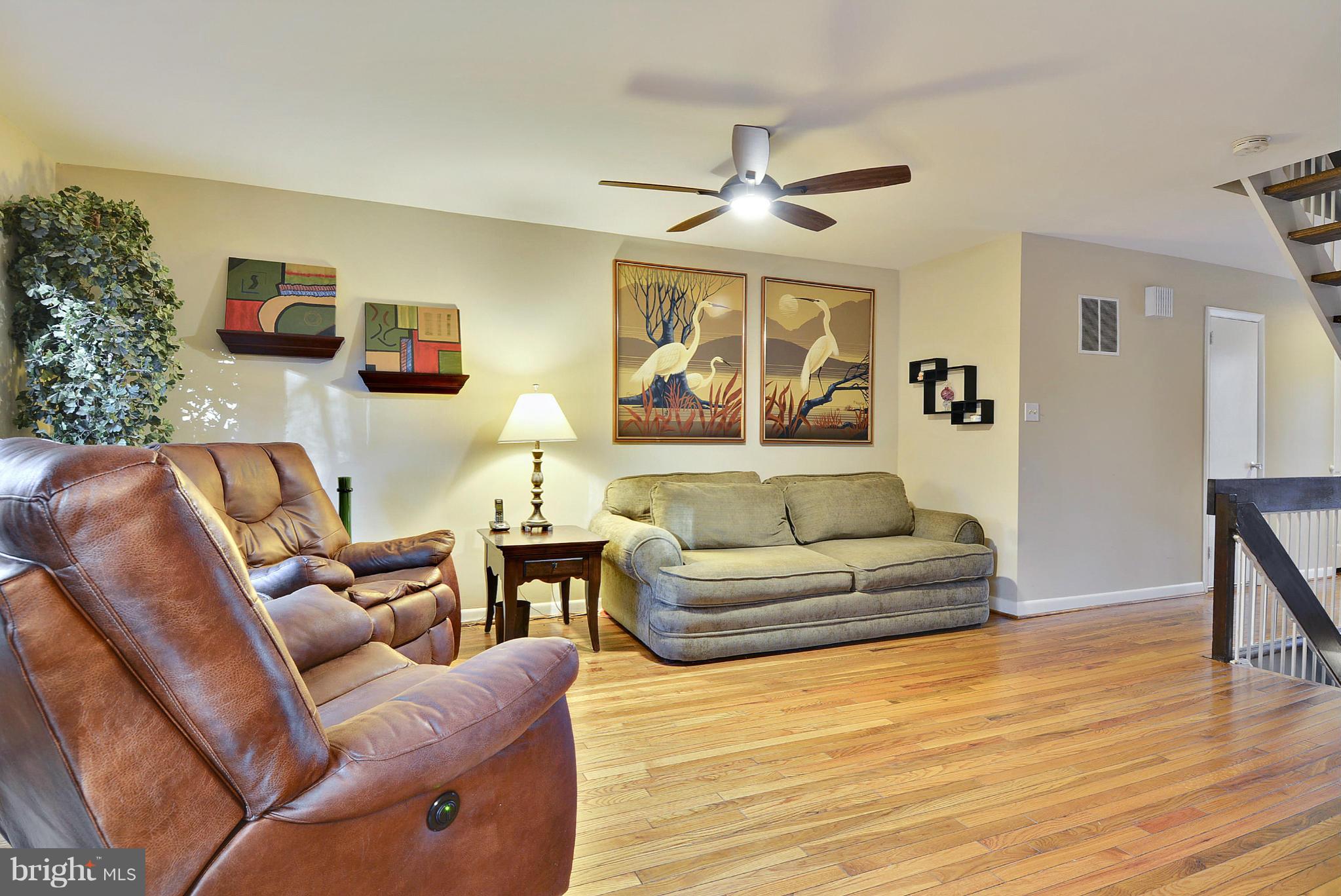 2024 Golf Course Drive Reston, VA 20191 - Photo 4 of 30 a living room with furniture and a wooden floor