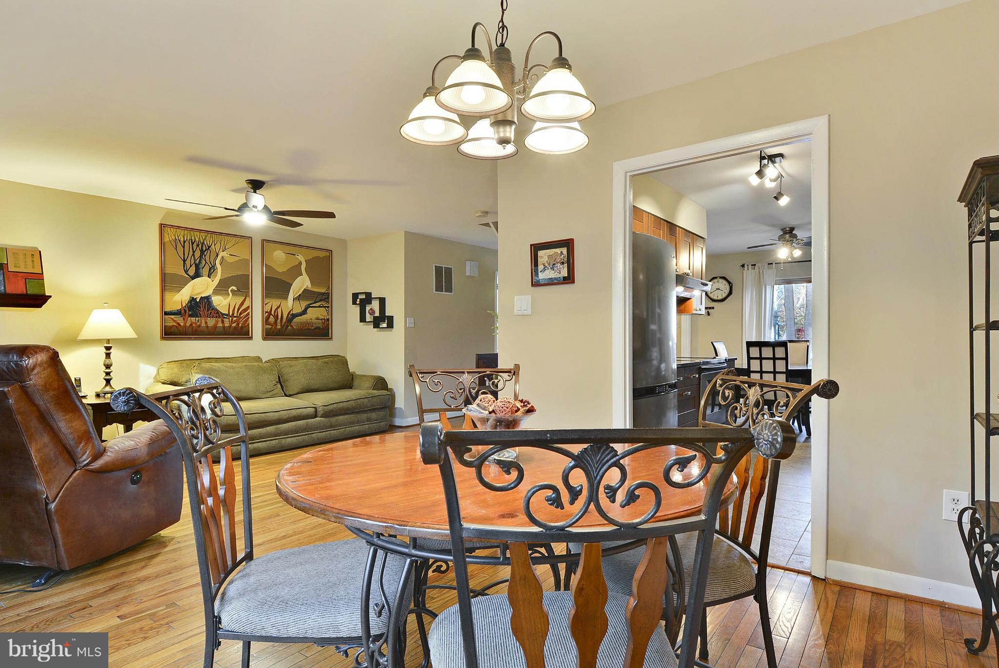 2024 Golf Course Drive Reston, VA 20191 - Photo 7 of 30 a view of a dining room with furniture and wooden floor
