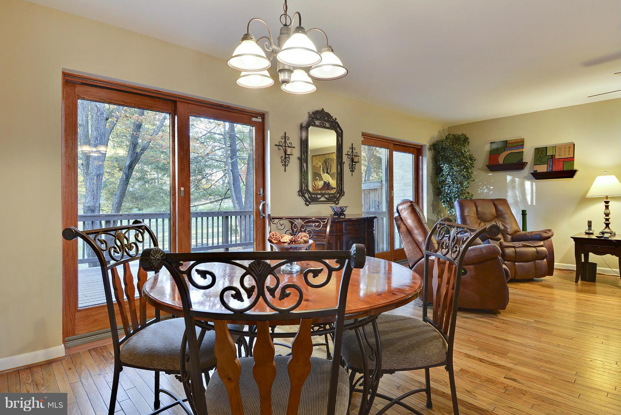 2024 Golf Course Drive Reston, VA 20191 - Photo 9 of 30 a view of a dining room with furniture window and wooden floor