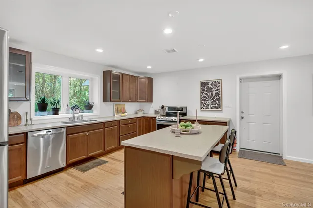 a large kitchen with a table and chairs in it