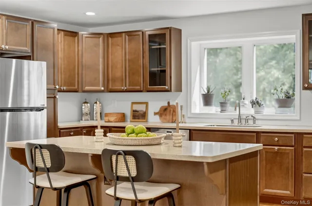 a dining table with chairs and window