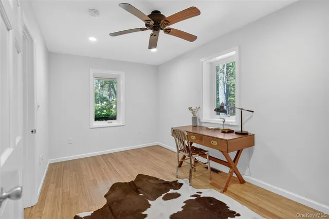 a workspace with furniture and window