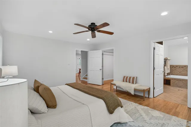 a bedroom with a bed and white walls