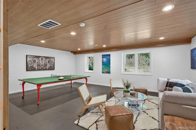 a living room with furniture and window