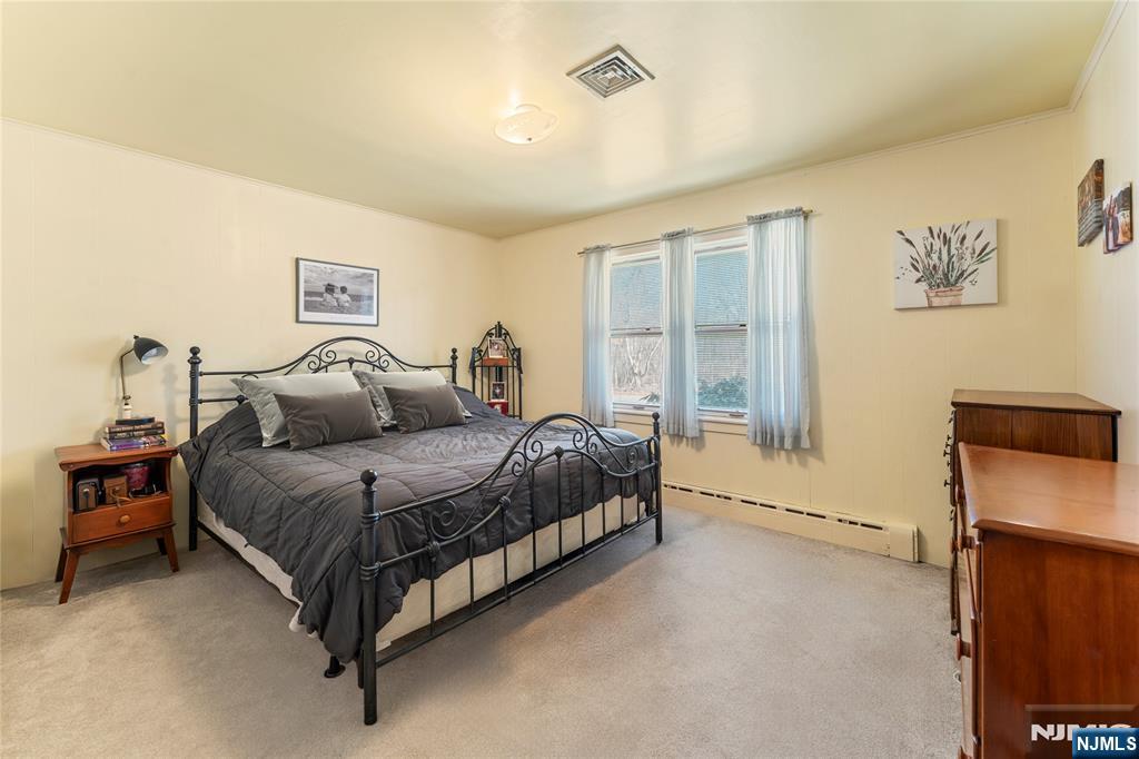 60 White Oak Road Parsippany, NJ 07054 - Photo 12 of 24 a spacious bedroom with a bed and a cabinets