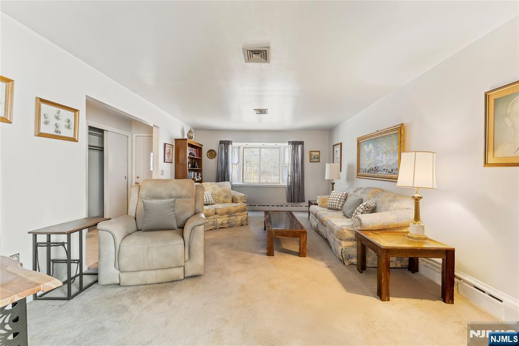 60 White Oak Road Parsippany, NJ 07054 - Photo 2 of 24 a living room with furniture and a wooden floor