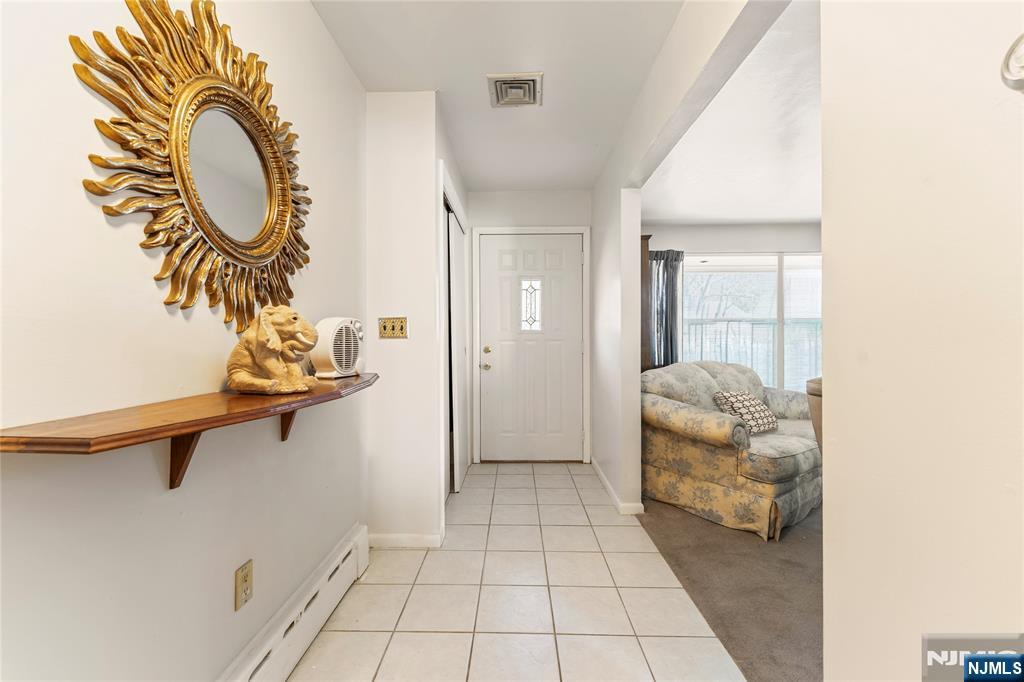 60 White Oak Road Parsippany, NJ 07054 - Photo 6 of 24 a room with a table and a mirror