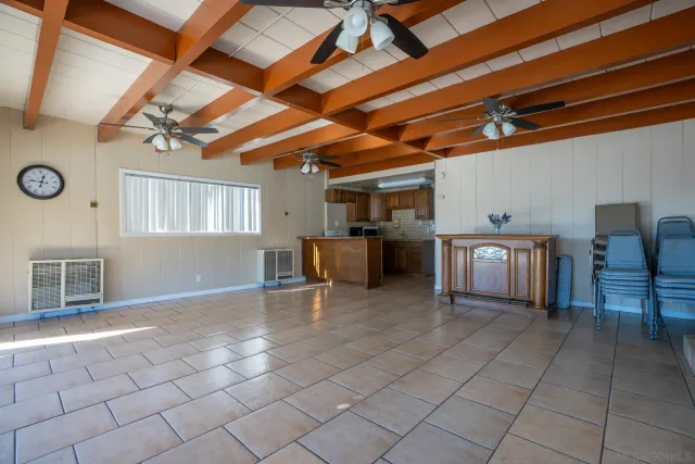 a kitchen with stainless steel appliances kitchen island granite countertop a sink and cabinets