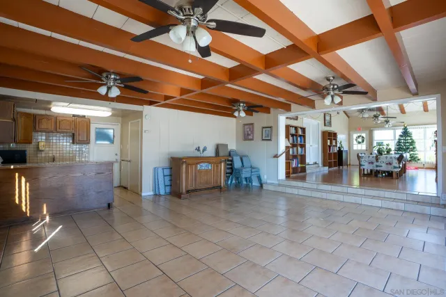 a view of a house with swimming pool and sitting area