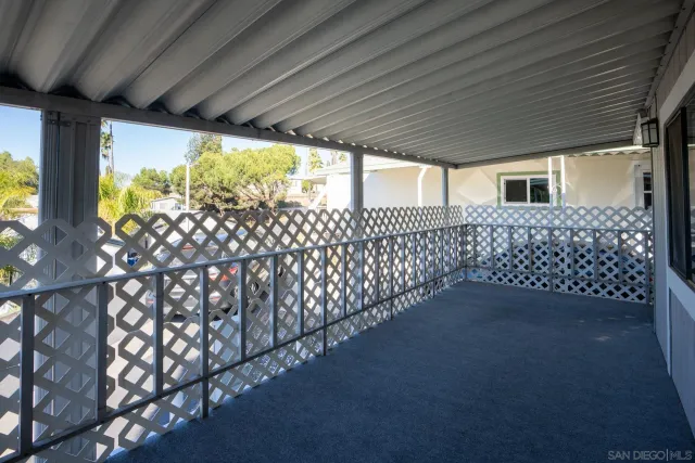 a view of a house with a flower garden